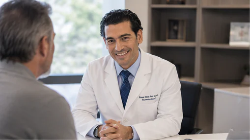 Dr. Nathanael Sabbah speaking with a patient during a consultation
